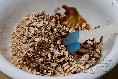 Stirring Granola to Coat