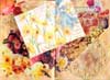 This altered book spread entitle Gather Flowers by Kristi consists of magazine clipping collage and rubber stamp art.