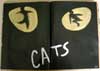 View the altered book page Cats.