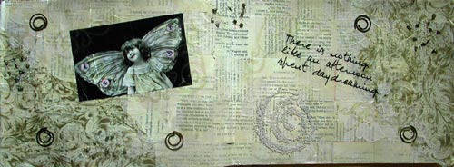 A variety of elements come together to form a rich, multi-layered and aged art journal spread.
