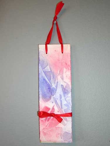 A vertically hanging stab bound book that works great for lists or poetry.