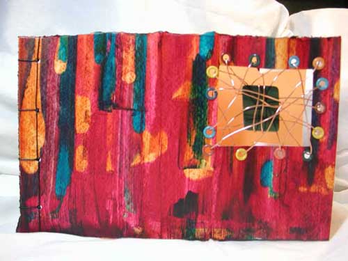 A vibrant soft cover Japanese stab bound book with window.