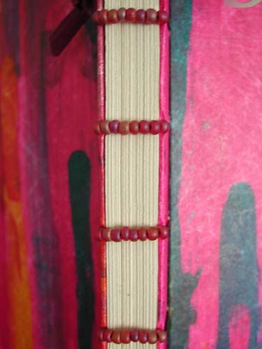 The stab binding of the book was embellished with beads.