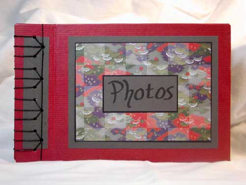 An Asian-inspired handmade stab bound book adorned with origami paper.