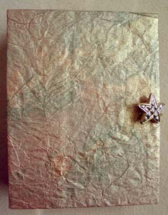The front of an envelope book where the cover was left unadorned for the recipient to finish to her liking.
