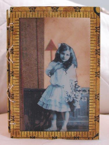 A closer look at the layered cover of the pocket-sized journal.
