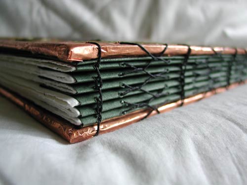 A sturdy and functional, yet decorative binding holds the 48 pages together while still allowing the book to lie flat when opened.