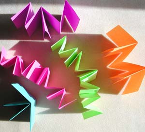 A plethora of puzzle books, each made from a single sheet of paper with no stitching.