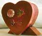 A boxed accordion book in the shape of a heart.