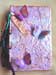 A piano hinge journal decked out with fibers and beads and 3-d butterflies made of acetate.