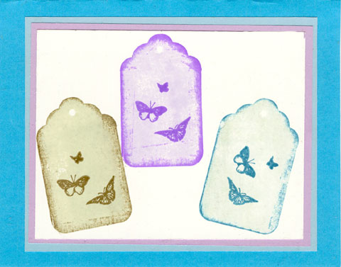 A fun shadow stamped tags with butterflies added to the tags.
