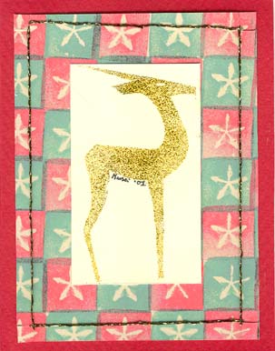 A traditional colored Christmas card using a hand carved stamp.