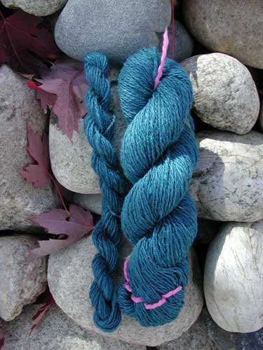 Hand spun silk and merino 2-ply yarn.