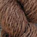 A light red alapaca roving spun into a lofty and soft heavy worsted weight yarn.