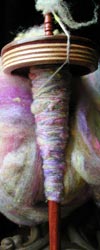 See yarns Kristi spun with the more portable drop spindle.