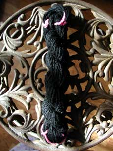 1 oz or 68 yds of sock weight hand spun wool/alpaca yarn.