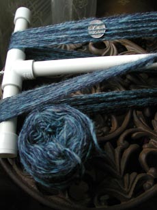 Coopworth 2-ply on PVC niddy noddy and the remaining center pull ball of singles.