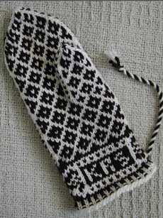 The palm side of some chocolate and cream Mitten from Halland.