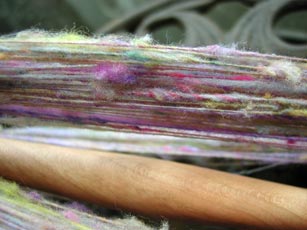 A closer look at the spun yarn to see the neps and the evenness of the regular part of the yarn.