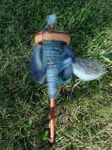Coopworth roving on my drop spindle.