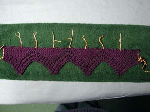 The blocked lace ready to pick up stiches and begin the main body.