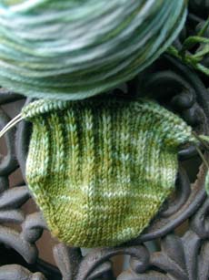The beginnings of a toe-up sock using a turkish cast-on and a wedge toe.