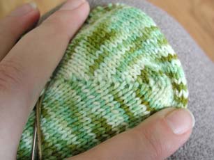 The wrapped stitches that were picked up and knit on the RS.