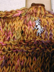 Detail of pewter Kokipelli charm on the Southwest Purse.