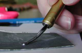 See how to sharpen your gouges and tools for carving using fine grit sand paper.
