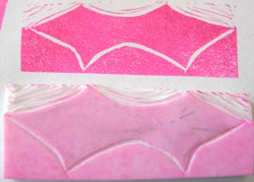 Note how the high points of the background still print and how you can see which ones are printing because of the residue of contrasting ink.