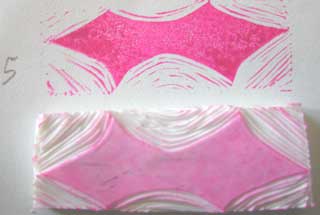 Note how the high points from removing the excess material is printing to the paper and that it is stained by the contrasting dye ink to help you decide what areas need to be removed yet.